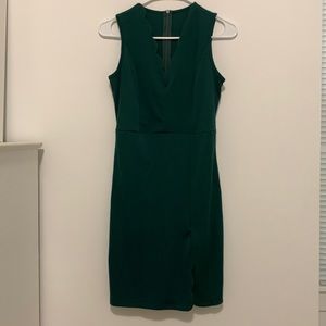 Deep emerald green cocktail dress with scalloped detailing